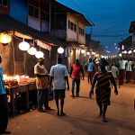 **Prompt:** A bustling street in Kumasi, Ghana, during a power outage. Lanterns and candlelight illuminate vendors and people socializing in the darkness. Focus on the resilience and community spirit.